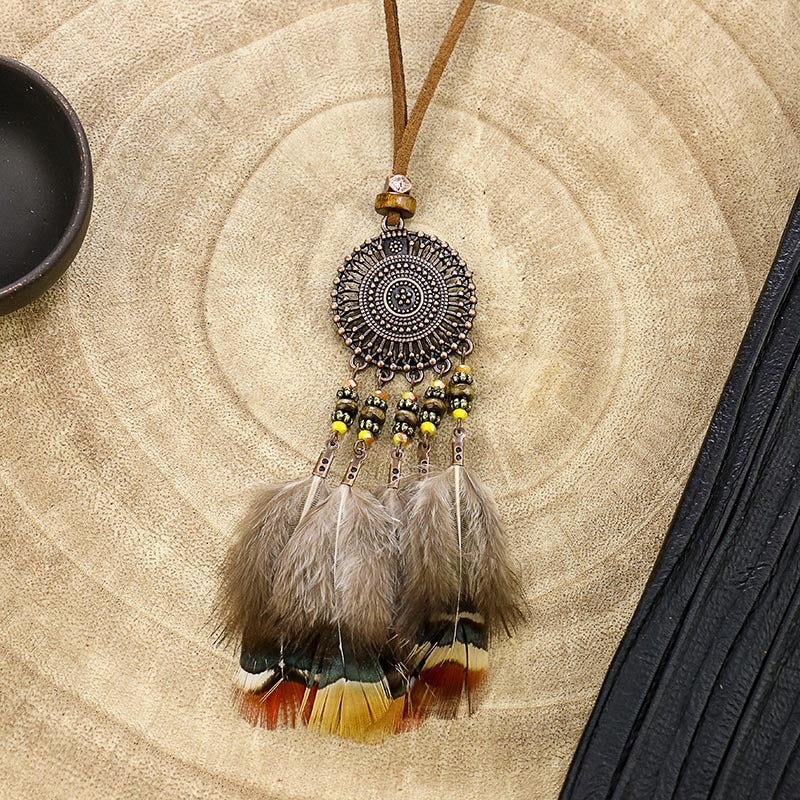 Vintage hollow round feather necklace